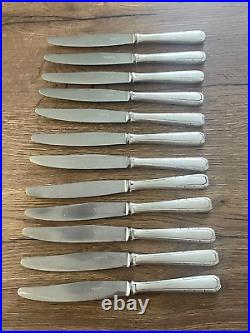 12 anciens couteaux à viande en métal argenté Alfenide modèle Tosca art déco