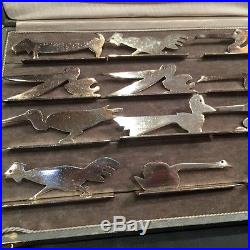 12 porte couteaux métal argenté découpé de VOREL, cubistes, animaux, Art Déco