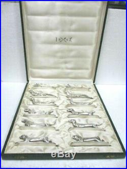 Ancienne série de 12 porte couteaux animaliers en métal argenté