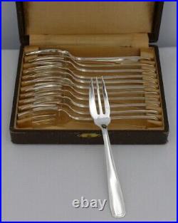 Boulenger Art Déco modèle Suzy, 12 fourchettes à gâteaux en métal argenté