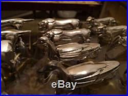 Série de 12 porte couteaux métal argenté animaliers sandoz 1925 1930 art déco